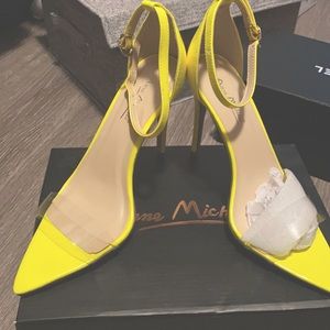 Brand new neon yellow strapped heel.